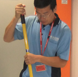 Data centre cleaning staff with id tag