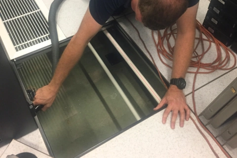 Comms room sub-floor cleaning