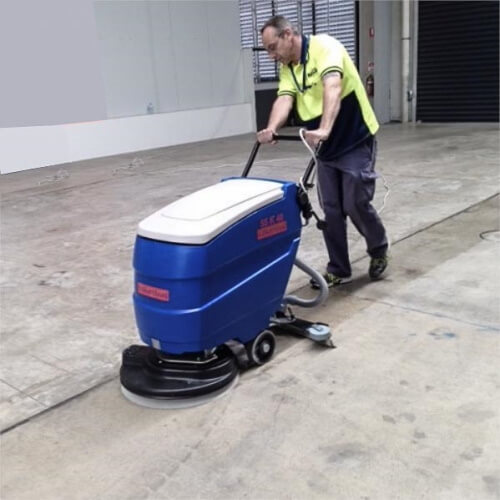 Scrub-washing concrete floor