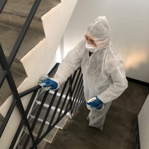 Disinfection cleaning on staircase railings